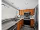 Modern kitchen with stainless steel appliances and granite countertops at 117 10Th N St # 122, Bradenton Beach, FL 34217