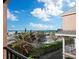 Breathtaking ocean view from the balcony, showcasing palm trees and beach at 117 10Th N St # 122, Bradenton Beach, FL 34217