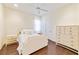 Bedroom with a queen bed, hardwood floors, and built-in dresser at 11740 Rive Isle Run, Parrish, FL 34219