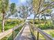 Scenic boardwalk leading to waterfront access at 11740 Rive Isle Run, Parrish, FL 34219