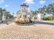 Gated community entrance with fountain and landscaping at 11740 Rive Isle Run, Parrish, FL 34219