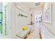 Bright hallway with built-in bench and storage at 11740 Rive Isle Run, Parrish, FL 34219