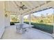 Covered patio with ping pong table and lush landscaping at 11740 Rive Isle Run, Parrish, FL 34219