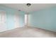 Light blue walls and carpeted bedroom with double closets at 1204 W 20Th Ave, Palmetto, FL 34221