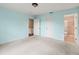 Spacious bedroom with light blue walls and carpet at 1204 W 20Th Ave, Palmetto, FL 34221