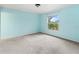 Light blue bedroom with carpet and a window at 1204 W 20Th Ave, Palmetto, FL 34221