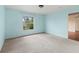 Bedroom with light blue walls, carpet, and window at 1204 W 20Th Ave, Palmetto, FL 34221