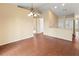 Open dining area, hardwood-style floors, kitchen access at 1204 W 20Th Ave, Palmetto, FL 34221