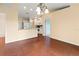 Dining room with kitchen view and wood-look floors at 1204 W 20Th Ave, Palmetto, FL 34221