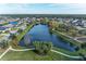 Community features a scenic lake, walking paths, and beautifully landscaped areas at 12941 Bliss Loop, Bradenton, FL 34211