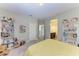 Bedroom with built-in bookcases and yellow bedding at 12941 Bliss Loop, Bradenton, FL 34211