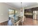 Kitchen dining area with sliding glass doors leading to the pool area at 12941 Bliss Loop, Bradenton, FL 34211