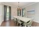 Elegant dining room with large table and chandelier at 12941 Bliss Loop, Bradenton, FL 34211