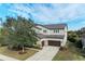 Two-story house with a brown garage door and landscaping at 12941 Bliss Loop, Bradenton, FL 34211