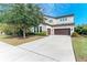 Two-story house with a driveway and landscaping at 12941 Bliss Loop, Bradenton, FL 34211