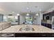 Island kitchen with granite countertop, double sink, and view to the backyard at 12941 Bliss Loop, Bradenton, FL 34211