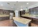 Gourmet kitchen featuring granite countertops and ample cabinetry at 12941 Bliss Loop, Bradenton, FL 34211