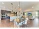 Open concept kitchen and dining area with hardwood floors at 12941 Bliss Loop, Bradenton, FL 34211