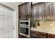 Modern kitchen with stainless steel appliances and granite countertops at 12941 Bliss Loop, Bradenton, FL 34211