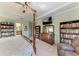 Main bedroom with king-size bed, built-ins, and ensuite access at 12941 Bliss Loop, Bradenton, FL 34211