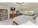 Spacious main bedroom with a king-size bed and built in shelving at 12941 Bliss Loop, Bradenton, FL 34211