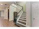 Elegant staircase with dark wood treads and white risers at 12941 Bliss Loop, Bradenton, FL 34211