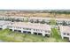 Aerial view of townhouses showcasing backyards and screened patios at 15127 Lyla Ter, Bradenton, FL 34211