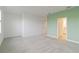 Bright bedroom with grey carpet and access to en-suite bathroom at 15127 Lyla Ter, Bradenton, FL 34211