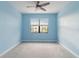 Light blue bedroom with ceiling fan and window coverings at 15127 Lyla Ter, Bradenton, FL 34211