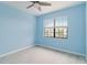 Light blue bedroom with ceiling fan and window coverings at 15127 Lyla Ter, Bradenton, FL 34211