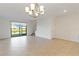 Bright dining room with water view, chandelier, and tile floors at 15127 Lyla Ter, Bradenton, FL 34211