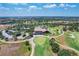 Aerial view of clubhouse, parking lot, and golf course at 16621 Berwick Ter, Lakewood Ranch, FL 34202