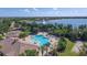 Community pool and clubhouse with lake view at 16621 Berwick Ter, Lakewood Ranch, FL 34202