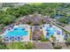 Two pools with shade structures and lounge chairs at 16621 Berwick Ter, Lakewood Ranch, FL 34202