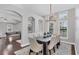 Elegant dining room with chandelier and seating for six at 16621 Berwick Ter, Lakewood Ranch, FL 34202