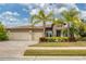 Two-story house with stone accents and palm trees at 16621 Berwick Ter, Lakewood Ranch, FL 34202