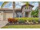 Inviting entryway with teal door and stone facade at 16621 Berwick Ter, Lakewood Ranch, FL 34202