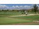 Driving range with practice putting green and residential homes in background at 16621 Berwick Ter, Lakewood Ranch, FL 34202