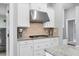 Kitchen with gas cooktop, granite counters, and mosaic backsplash at 16621 Berwick Ter, Lakewood Ranch, FL 34202