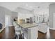 Island kitchen with granite countertops and white cabinetry at 16621 Berwick Ter, Lakewood Ranch, FL 34202