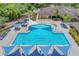 Resort-style lap pool with shade structures and plenty of lounge chairs at 16621 Berwick Ter, Lakewood Ranch, FL 34202