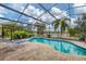 Inviting screened pool with a large patio and lounge chairs at 16621 Berwick Ter, Lakewood Ranch, FL 34202