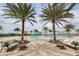 Resort-style pool with lounge chairs and palms at 16621 Berwick Ter, Lakewood Ranch, FL 34202