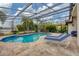 Relaxing pool with lounge chairs in a screened enclosure at 16621 Berwick Ter, Lakewood Ranch, FL 34202