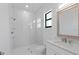 Clean bathroom with white vanity, marble shower, and modern fixtures at 17250 Lake Worth Blvd, Port Charlotte, FL 33948