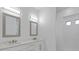 Modern bathroom with double vanity and updated lighting at 17250 Lake Worth Blvd, Port Charlotte, FL 33948