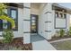 Modern front entrance with glass door and black accents at 17250 Lake Worth Blvd, Port Charlotte, FL 33948