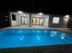 Inviting pool and patio area with modern lighting, showcasing a relaxing outdoor space at 17250 Lake Worth Blvd, Port Charlotte, FL 33948