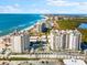 Aerial view of beachfront condo building with ocean and coastal views at 2050 Benjamin Franklin Dr # B304, Sarasota, FL 34236