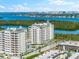 Aerial view of two luxurious condo buildings near the water at 2050 Benjamin Franklin Dr # B304, Sarasota, FL 34236